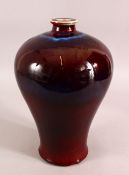A CHINESE RED AND PURPLE FLAMBE GLAZED VASE, 33cm high.