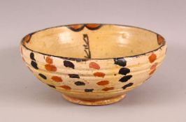 AN EARLY NISHAPUR GLAZED POTTERY BOWL, 16cm diameter.