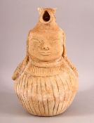 AN UNUSUAL EARLY SELJUK UNGLAZED POTTERY EWER, with the handle moulded as an animal, the ewer with a