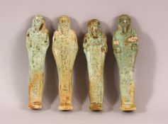 A LOT OF FOUR ANCIENT EGYPTIAN POTTERY USHABTI FIGURES - Each with a turquoise glaze and Egyptian
