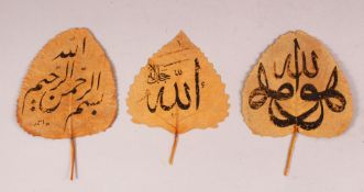 THREE ISLAMIC LEAFS WITH CALLIGRAPHY - each leaf with some ink calligraphy work (3)