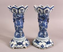 A PAIR OF VERY UNUSUAL SHAPED CHINESE BLUE AND WHITE CANDLE STANDS - FOR THE ISLAMIC MARKET, the