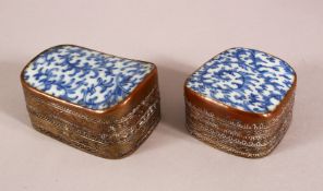 TWO 19TH CENTURY CHINESE BLUE AND WHITE PORCELAIN AND METAL POWDER BOXES, the metal mounts