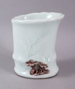 A CHINESE CELADON BAMBOO FORMED PORCELAIN BRUSH WASH, the pot formed as a bamboo stalk with carved