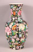 A CHINESE FAMILLE ROSE MILLEFLUER STYLE PORCELAIN VASE, decorated upon a black ground with profuse