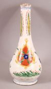 A TURKISH KUTHAYA POTTERY TULIP STEM NECK VASE, with panel floral motifs, 23.5cm