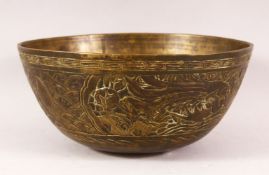 A 19TH / 20TH CENTURY CHINESE CARVED BRONZE DRAGON BOWL - the body incised with dragons amongst