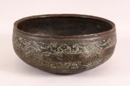 A 16TH CENTURY PERSIAN EARLY SAFAVID ENGRAVED BRONZE BOWL, 23cm diameter.