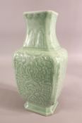 A CHINESE SQUARE FORM CELADON VASE with relief decoration, six character mark to the base, 32.5cm