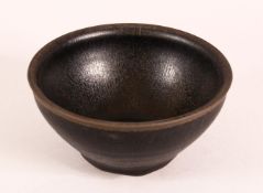 A CHINESE POTTERY TEA BOWL, with 'hare's fur' glaze, 12cm diameter.