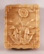 AN INDIAN ALABASTER RECTANGULAR BOX AND COVER, the lid carved with flower, 11cm x 8.5cm.