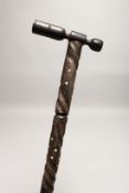 AN AFRIACN BONE INLAID WALKING STICK 2ft 9ins long