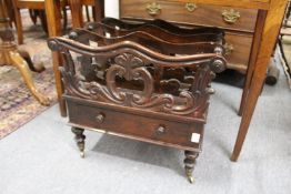 A REGENCY ROSEWOOD CANTERBUTY with shaped three division top single drawer on turned legs with