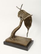 AFTER SALVADOR DALI, AN ABSTRACT BRONZE GROUP OF A MELTING CLOCK ON A TABLE, mounted on a