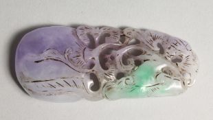 A CHINESE CARVED LILAC JADE PENDANT 3.5ins long