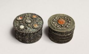 TWO ISLAMIC FILIGREE CIRCULAR BOXES set with hard stones 2ins & 1.75ins diameter