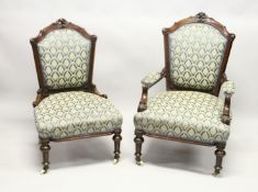 A GOOD VICTORIAN MAHOGANY FRAMED ARMCHAIR AND MATCHING NURSING CHAIR with matching covers on white