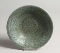 A CHINESE GREEN CRACKLE GLASS DISH with caligraphy.