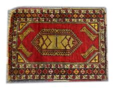 A SMALL PERSIAN/TURKISH RUG, red ground with central lozenge shape design (central join) 3ft 10ins x