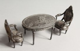 A GOOD SILVER TABLE AND PAIR OF CHAIRS