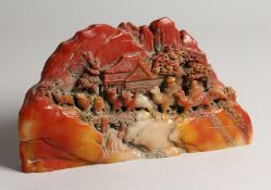 A CHINESE HARDSTONE CARVED BOULDER 9ins long