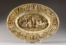 A SUPERB 18TH CENTURY EUROPEAN CARVED IVORY CIRCULAR DISH, the centre carved with nudes and