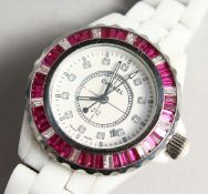 A CHANEL J 12 WHITE WATCH in a Chanel bag and box.