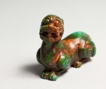 A CHINESE GREENSTONE FO DOG SCROLL WEIGHT