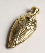 AN 18CT GOLD PLATED BIRD SCENT BOTTLE with glass eyes. 3ins long.