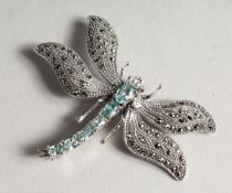 A SILVER MARCASITE AND BLUE TOPAZ DRAGONFLY BROOCH.