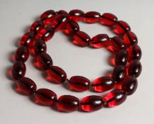 A LARGE STACK OF THIRTY TWO CHERRY BEADS.