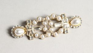 A CHANEL REPLICA BROOCH in a box