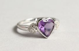A SILVER AMETHYST AND DIAMOND RING