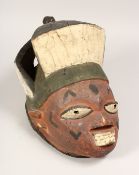 A PAINTED TRIBAL MASK 13ins long