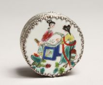 A CHINESE SILVERED CIRCULAR BOX AND COVER, famille rose top with figures. 2.25ins diameter