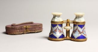 A VERY GOOD FRENCH MOTHER OF PEARL AND BLUE ENAMEL OPERA GLASSES, with garlands of roses 4.25ins