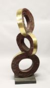 A LARGE POLISHED AND PATTINATED BRONZE ABSTRACT GROUP OF THREE CONJOINED CIRCLES, on a square base.