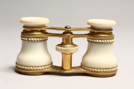 A PAIR OF IVORY AND GILT OPERA GLASSES 4.6ins long.