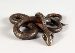 A SMALL WROUGHT IRON MODEL OF A SNAKE. 3ins wide.