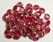 A GOOD 18CT GOLD RUBY SET CHAIN, set with four rubies