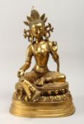 A LARGE CHINESE GILT BRONZE FIGURE OF A SEATED FEMALE DEITY 20ins high.