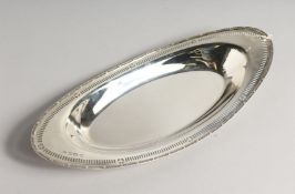 AN UNUSUAL SILVER BREAD DISH with pierced sides 14ins long Birmingham 1932, maker B. B. & Son.