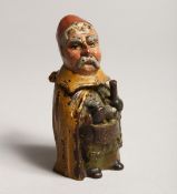 A COLD PAINTED MAN MATCH STRIKER 2.75ins high.