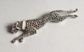 A SILVER MARCASITE AND MOTHER OF PEARL BROOCH