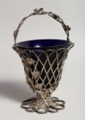 A GOOD VICTORIAN SILVER PIERCED BASKET TYPE SUGAR BASKET, with vine leaves London 1874, maker H & T