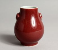 A CHINESE SANG DE BOUEF TWO HANDLED VASE