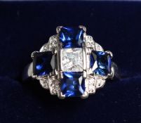 A SILVER CZ AND SAPPHIRE RING