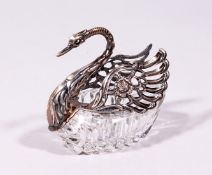 A CUT GLASS .835 SILVER SWAN, with silver head, neck and wings. 4.5ins long.