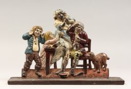 A LATE 19TH CENTURY CAST IRON AND PAINTED FIGURE DOOR STOP 11.5ins long