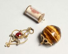 TWO GOLD CHARMS, one with a ten shilling note.